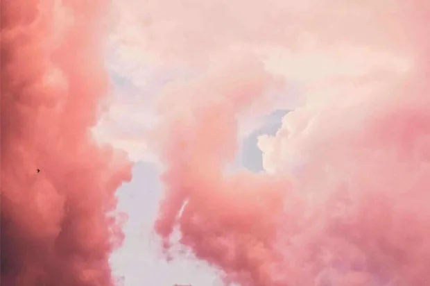 Pink clouds with soft, fluffy edges drift across a light blue sky, evoking the calm and clarity found when reflecting on CDP 2020 questions.