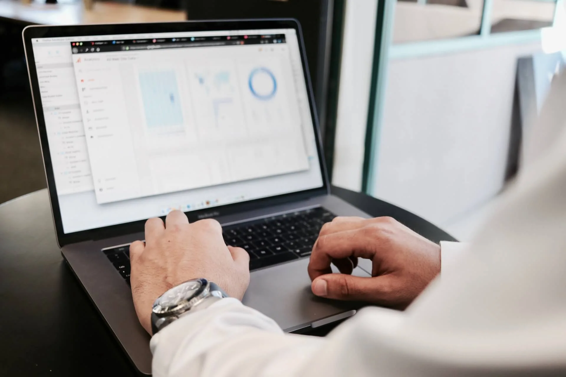 EHS professional on a laptop looking at Cority Enviance Calculation Graph Visualizer