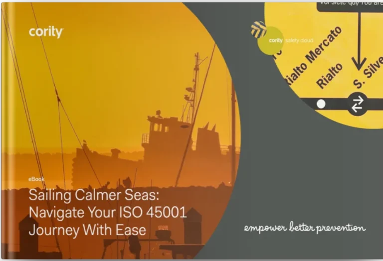 Yellow-orange cover with a ship silhouette and circular overlays, highlighting an ISO 45001 journey eBook by Cority.