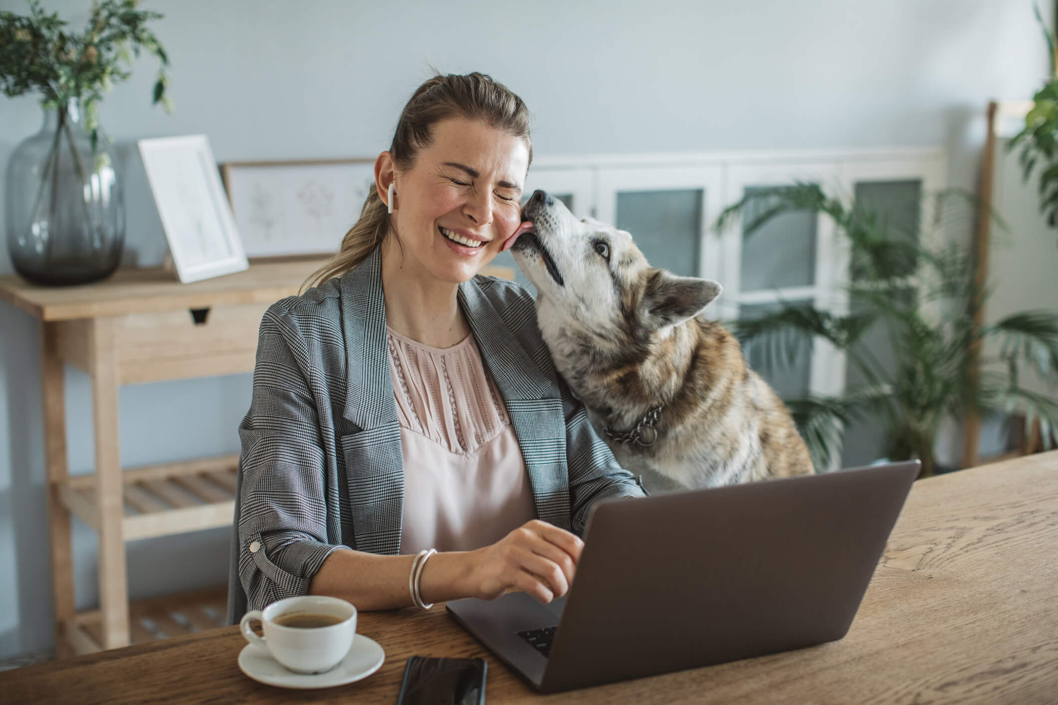 Telehealth Blog Woman on Computer with Dog Cority
