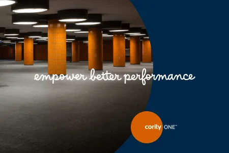 Underground space with orange columns and text: empower better performance, highlighting EHS Excellence. Cority ONE logo in corner.