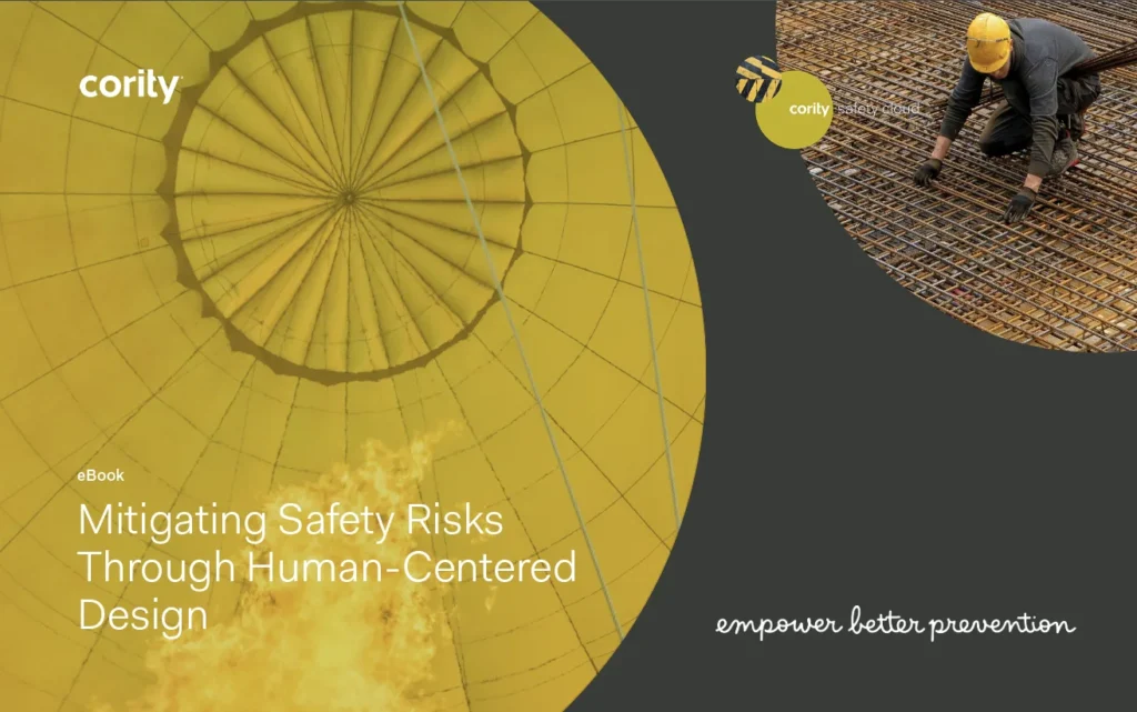 Yellow-tinted safety cover with worker inspecting steel bars; text reads “Mitigating Safety Risks Through Human-Centered Design Safety Management.”.