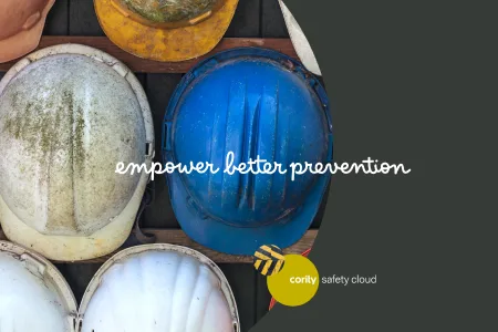 Several construction helmets, mostly white and one blue, emphasize the message empower better prevention—highlighting the importance of contractor management strategies on every jobsite.
