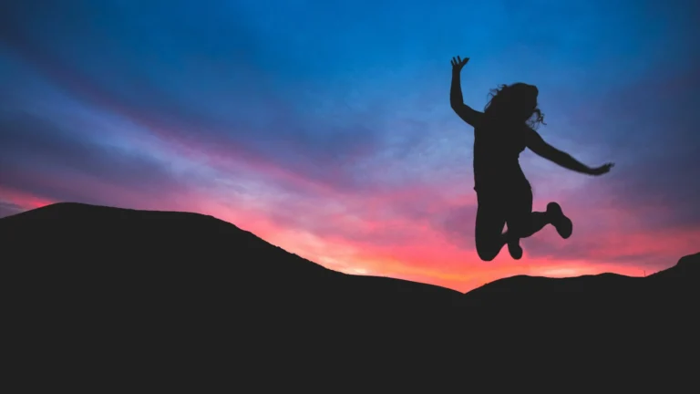 net zero decarbonization blog female figure jumping pink cority