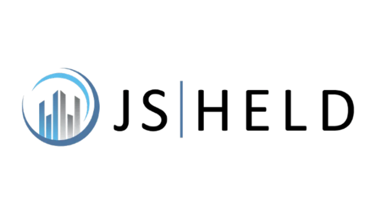 JS Held logo featuring stylized blue and gray buildings inside a circular design on the left, with the text JS | HELD in bold black letters to the right.