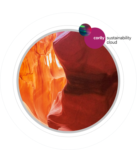 A circular image shows the vibrant orange and red curves of a slot canyon. In the upper right, a purple circle labeled “Cority Sustainability Cloud” with a small green and blue accent highlights Cority and Greenstone’s commitment to sustainability.
