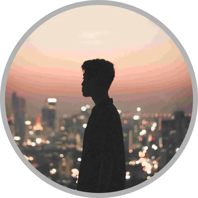 Silhouette of a person in profile standing against a blurred cityscape at dusk, with colorful lights and a gradient sky in the background, viewed through a circular frame.