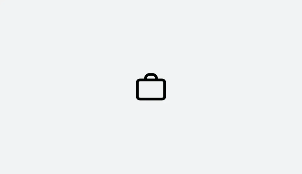 A simple black outline of a briefcase icon, centered on a light gray background, symbolizing professionalism and organization—ideal for representing an EHS Software Platform.