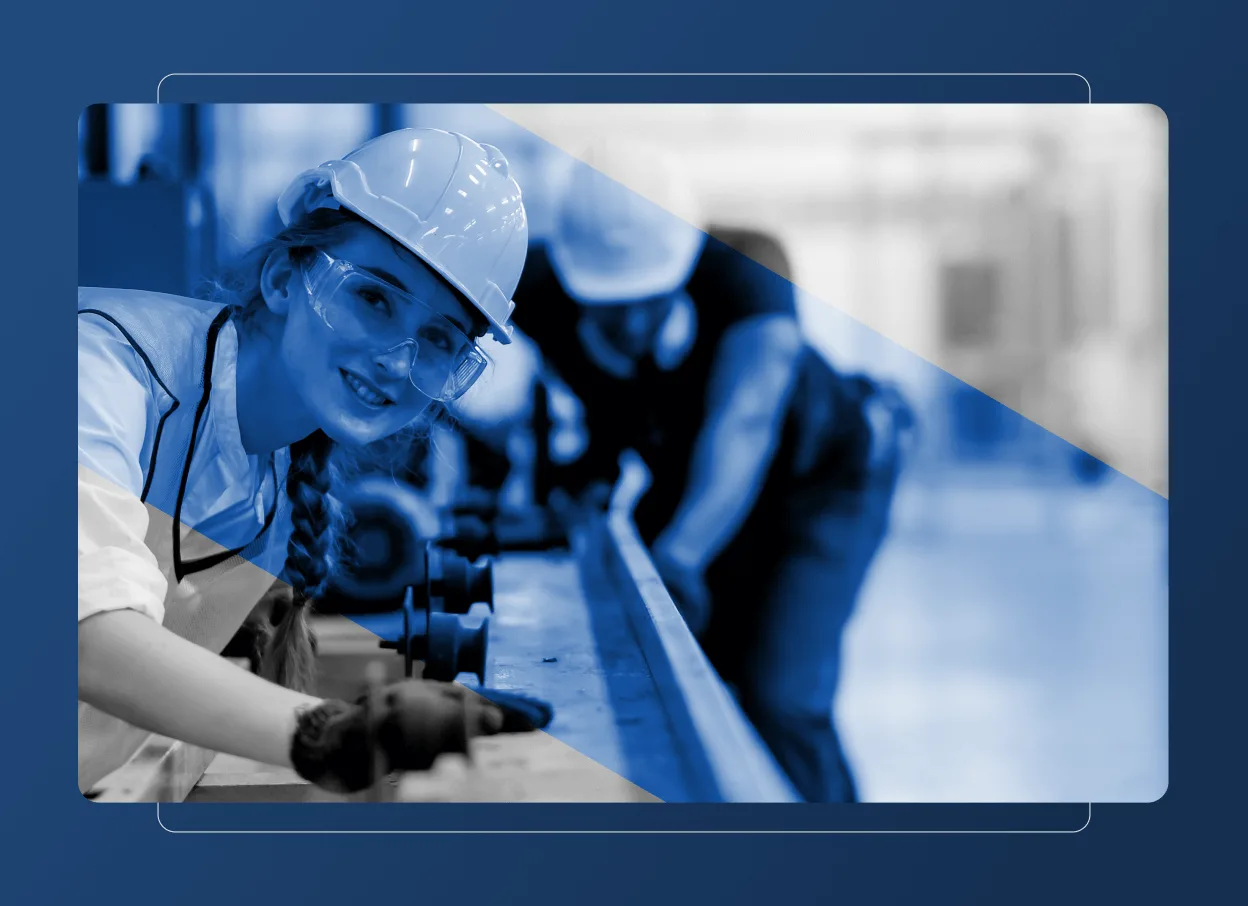 A smiling woman wearing a hard hat, safety glasses, and gloves works at an industrial table in the energy industry, while another person is busy in the background. The image has a blue overlay with a diagonal transparent section.