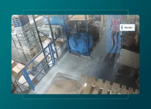 A warehouse with shelves, pallets, and stacked boxes. A highlighted figure labeled Worker stands near the right, outlined with red lines and blue shading for detection by a monitoring system, integrated with Health Cloud for enhanced safety oversight.