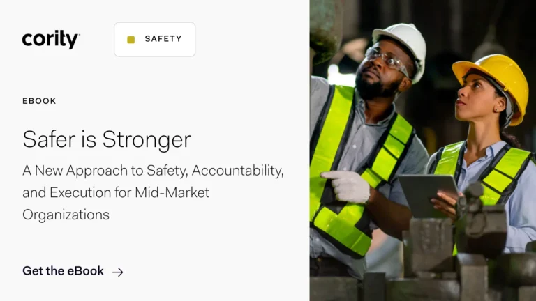 Two workers wearing safety vests, gloves, and hard hats inspect equipment in an industrial setting. The left side of the image features text promoting a Cority EHS software eBook for mid-market organizations.